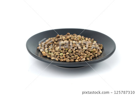 Hemp seeds, cannabis grains, marijuana kernels, oil hempseeds pile 125787310