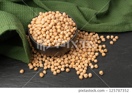 Chickpea, chick pea pile, dry Cicer arietinum fruits, raw Bengal gram legume, garbanzo beans 125787352