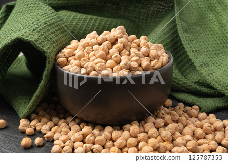 Chickpea, chick pea pile, dry Cicer arietinum fruits, raw Bengal gram legume, garbanzo beans Chickpea, chick pea pile, dry Cicer arietinum fruits, raw Bengal gram legume, garbanzo beans 125787353