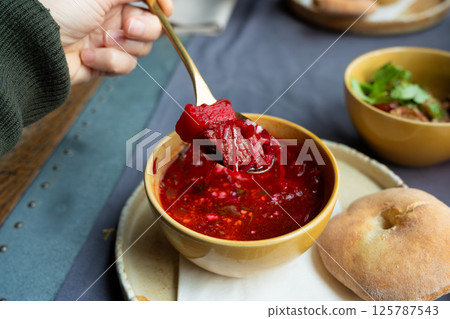 Borscht or borsch in bowl, Ukrainian beetroot soup. Red chowder thick borscht with sour cream 125787543