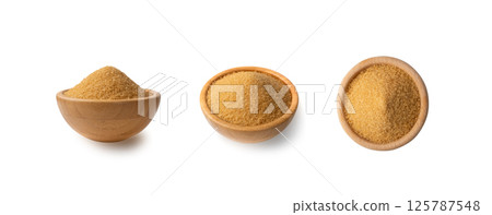 Eco bio brown sugar in wooden bowl isolated on black background Eco bio brown sugar in wooden bowl isolated on black background 125787548