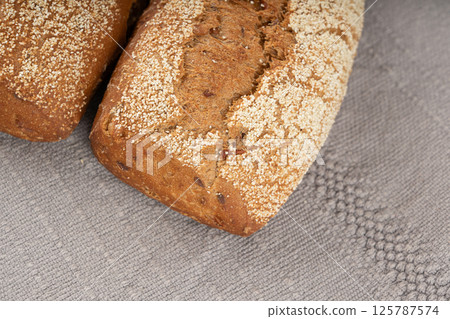 Whole wheat brown bread, fitness pumpkin carrot buns with seeds, cereal bread grain bun Whole wheat brown bread, fitness pumpkin carrot buns with seeds, cereal bread grain bun 125787574