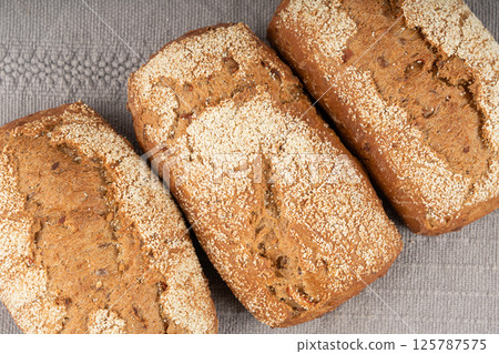 Whole wheat brown bread, fitness pumpkin carrot buns with seeds, cereal bread grain bun Whole wheat brown bread, fitness pumpkin carrot buns with seeds, cereal bread grain bun 125787575