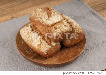 Whole wheat brown bread, fitness pumpkin carrot buns with seeds, cereal bread grain bun 125787576
