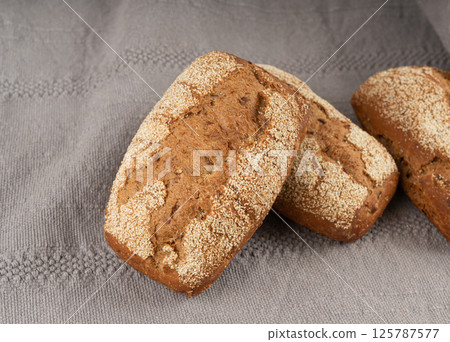 Whole wheat brown bread, fitness pumpkin carrot buns with seeds, cereal bread grain bun Whole wheat brown bread, fitness pumpkin carrot buns with seeds, cereal bread grain bun 125787577