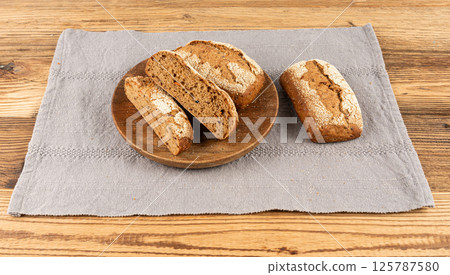 Whole wheat brown bread, fitness pumpkin carrot buns with seeds, cereal bread grain bun 125787580