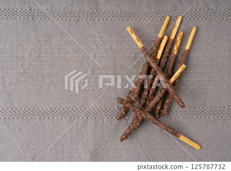 Chocolate cookie sticks, long choco pastries, japan biscuit tubes, korea cracker sticks 125787732