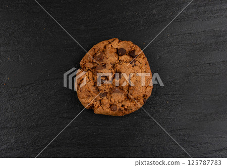 Chocolate chips pile cookies , American biscuits, cocoa confectionery cake, sweet morsels bakery Chocolate chips pile cookies , American biscuits, cocoa confectionery cake, sweet morsels bakery 125787783