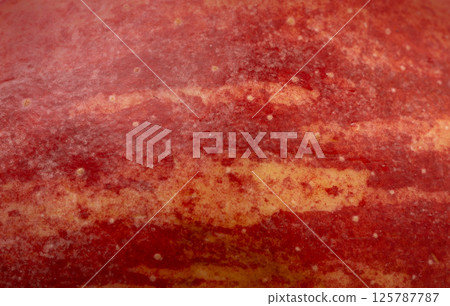Red apple skin macro texture. Honeycrisp fruit surface close up, fresh spotted and striped apple Red apple skin macro texture. Honeycrisp fruit surface close up, fresh spotted and striped apple 125787787