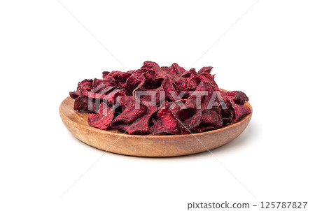 Dry beetroot chips isolated, dried sliced red beet flakes pile, beet root pieces and chips 125787827