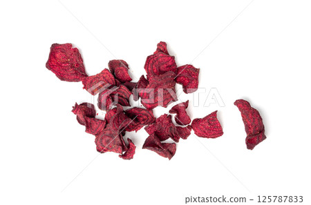 Dry beetroot chips isolated, dried sliced red beet flakes pile, beet root pieces and chips 125787833
