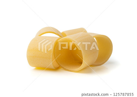 Raw Calamarata Big Pasta Isolated, Homemade Dry Macaroni, Italian Raw Round Noodle Raw Calamarata Big Pasta Isolated, Homemade Dry Macaroni, Italian Raw Round Noodle 125787855