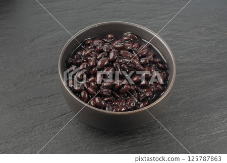Black beans, cooked bean piles, baked legume, canned dark beans, rajma, Phaseolus vulgaris 125787863