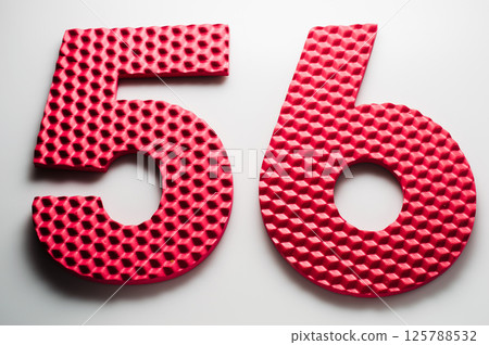 The number fifty-six. Part of the developing mat.  125788532