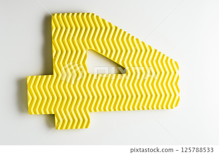 The number four is yellow. Part of the developing mat. The number four is yellow. Part of the developing mat. 125788533