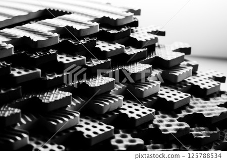 Black and white photo of a children's educational puzzle mat Mosaic Numbers.  125788534