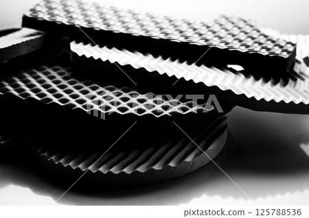 Black and white photo of a children's educational puzzle mat Mosaic Numbers.  125788536