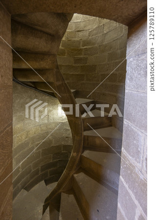 Narrow spiral staircase winding upwards in Baeza, Spain Narrow spiral staircase winding upwards in Baeza, Spain 125789110