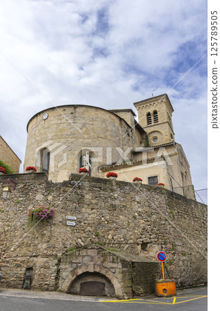 Saint Hilaire Abbey rising above stone wall in Aude, France 125789505