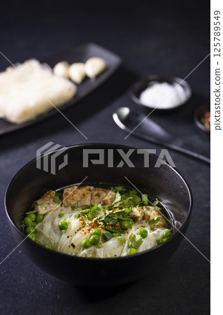 pho soup with duck breast and green peas pho soup with duck breast and green peas 125789549