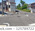 Narrow road in residential area 125789722