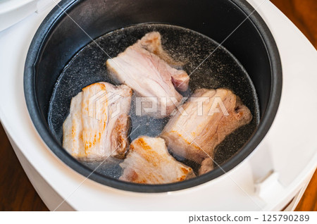 Pork belly cooked once in water Pork belly cooked once in water 125790289