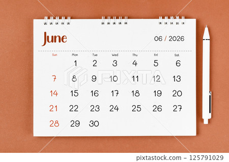 June 2026 Monthly desk calendar for 2026 year and pen. June 2026 Monthly desk calendar for 2026 year and pen. 125791029