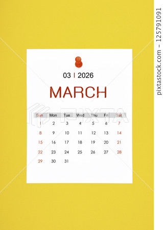 March 2026 calendar page with push pin on yellow background. March 2026 calendar page with push pin on yellow background. 125791091