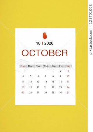 October 2026 calendar page with push pin on yellow background. October 2026 calendar page with push pin on yellow background. 125791098