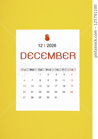 December 2026 calendar page with push pin on yellow background. 125791100