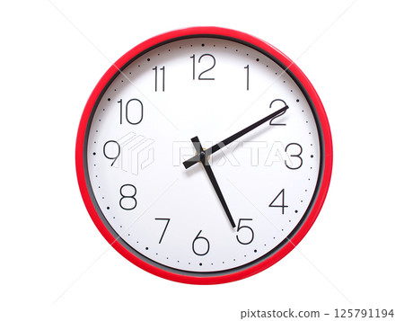 Minimalist red framed wall clock pointing at 05:10 or 17:10. Isolated on white background. Concept of time management. Minimalist red framed wall clock pointing at 05:10 or 17:10. Isolated on white background. Concept of time management. 125791194