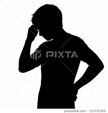 Silhouette of a worried man with his hands on his hips 125791569