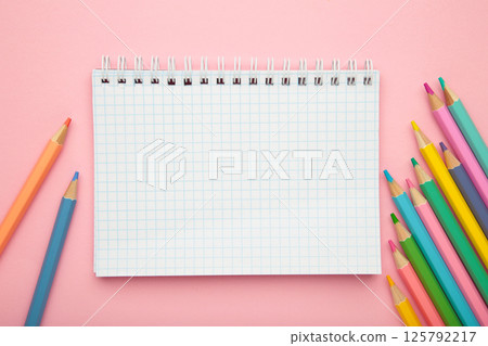 School supplies concept. Open notebook with colorful pencil 125792217