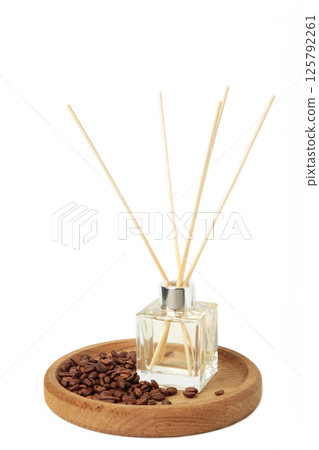 Reed diffuser and coffee beans isolated on white background. Reed diffuser and coffee beans isolated on white background. 125792261