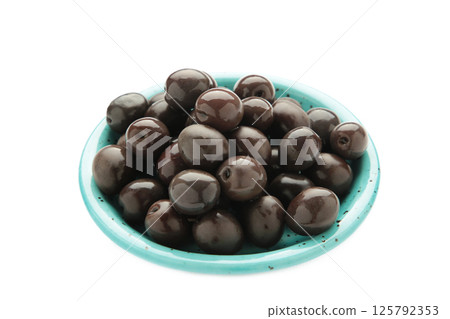 Blue bowl of pickled black olives isolated on white background, top view Blue bowl of pickled black olives isolated on white background, top view 125792353