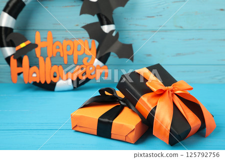 Halloween wreath with gift on blue background. Thanksgiving decor. 125792756