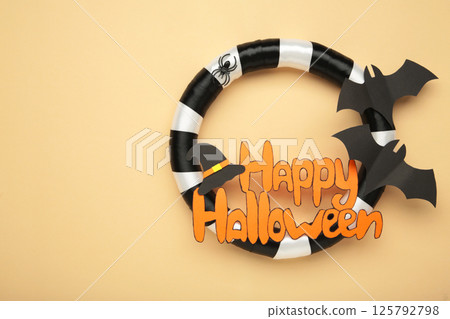 Halloween wreath on beige background. Thanksgiving decor. Top view 125792798