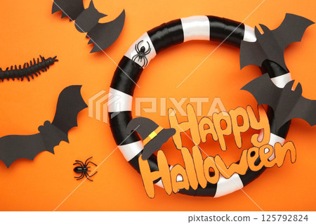 Halloween wreath on orange background. Thanksgiving decor. Top view 125792824