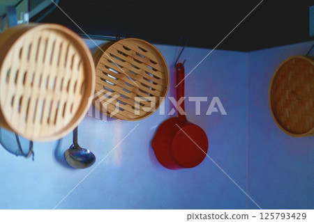 Cooking utensils hanging on the wall Cooking utensils hanging on the wall 125793429