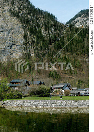 Hallstatt Austria. Alpine Village Nestled Between Mountain Cliffs 125793914