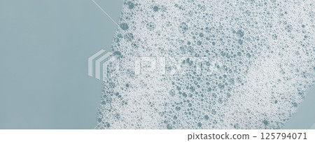 Texture of white foam. Cleansing mousse for the face or bath foam or washing powder. Copy space 125794071