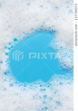 Texture of white foam. Cleansing mousse for the face or bath foam or washing powder. Copy space 125794073