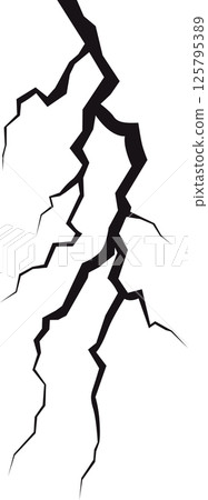 An intricate network of jagged, chaotic cracks streaks across a stark, shadowy plane, creating a visually striking and abstract texture. 125795389