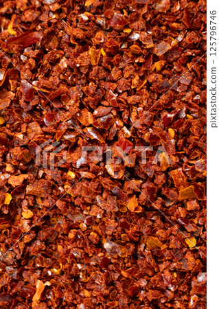 Spicy ground chili pepper close-up texture top view Spicy ground chili pepper close-up texture top view 125796746