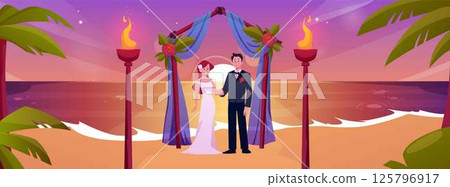 Beach wedding ceremony at sunset, with arch, bride, groom and torches. 125796917