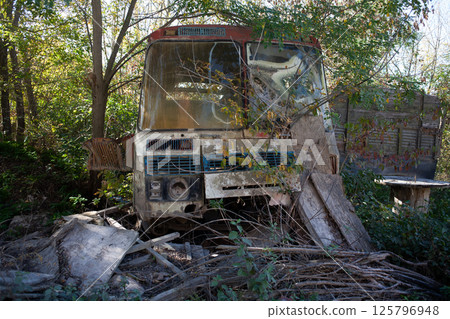 Broken abandoned rusty old vehicle. Retro damaged transportation. 125796948