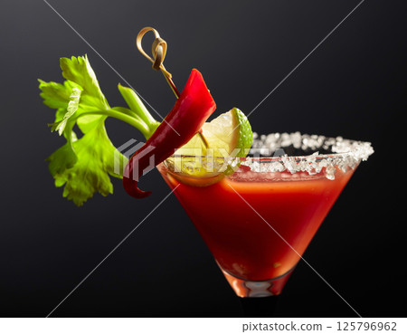 Bloody Mary cocktail with celery, lime, and pepper. 125796962