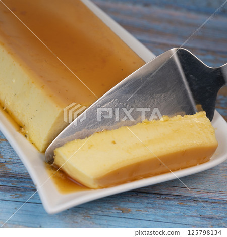 Cream caramel pudding with caramel sauce on a plate, Flan Cream caramel pudding with caramel sauce on a plate, Flan 125798134
