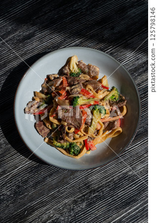 Pasta with beef, mushrooms and vegetables.  125798146