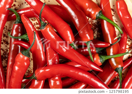 Close-up top view of red chili peppers. Close-up top view of red chili peppers. 125798195